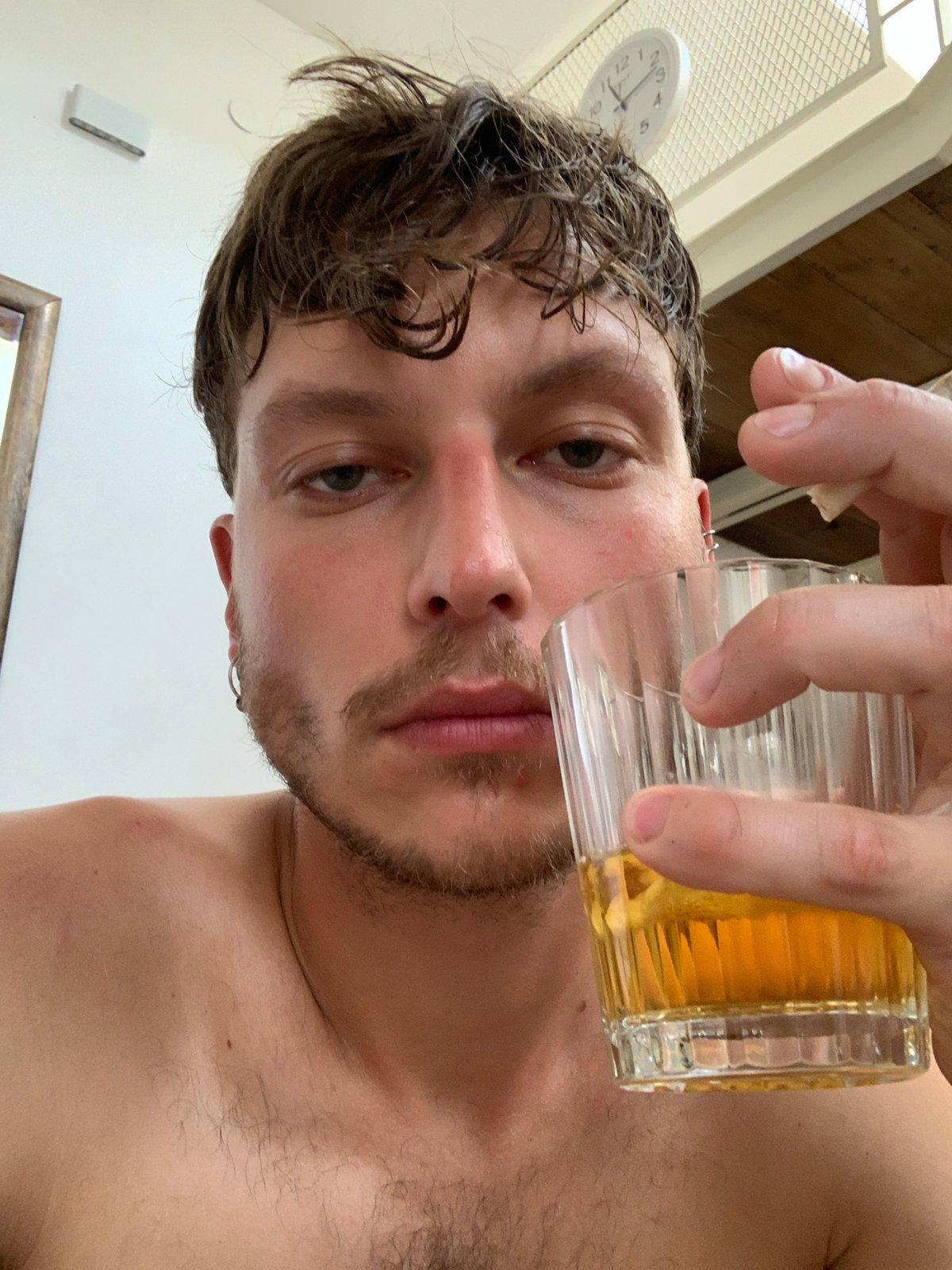 Man observed drinking beverage indoors in Tel Aviv apartment