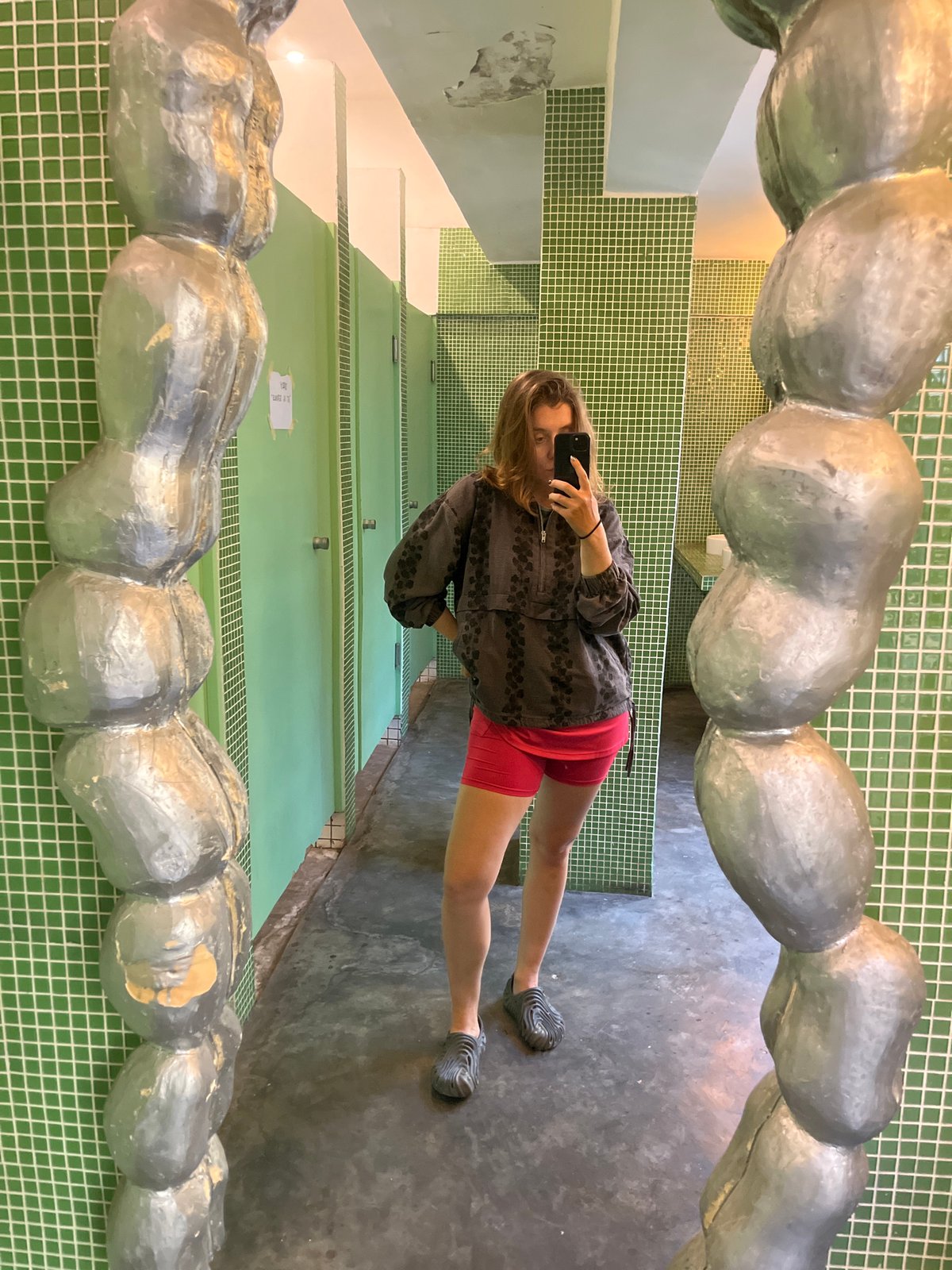 Cafe patron documents layered drink and bathroom in North Kuta