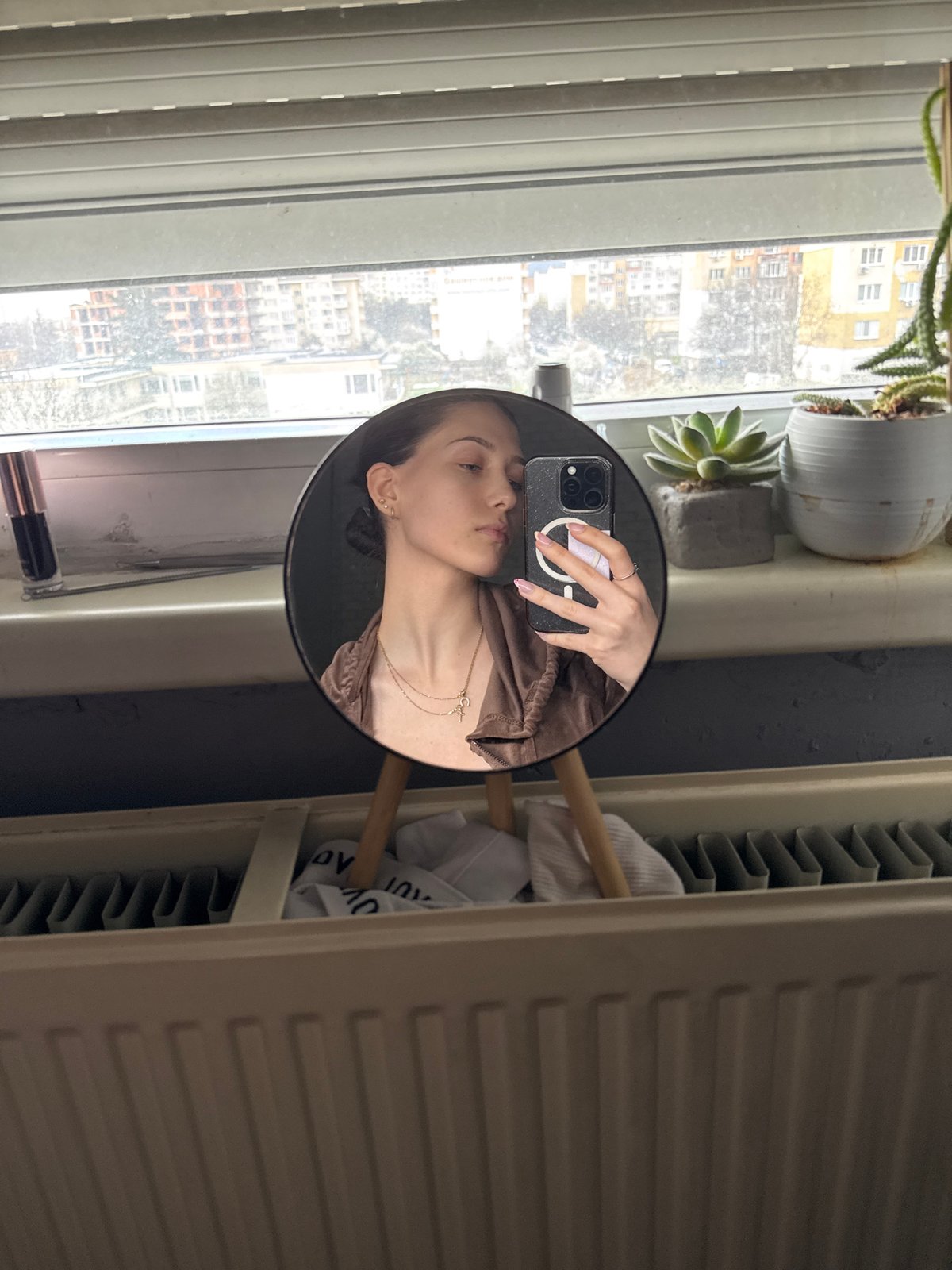 Woman rests on couch in Sofia apartment Saturday morning