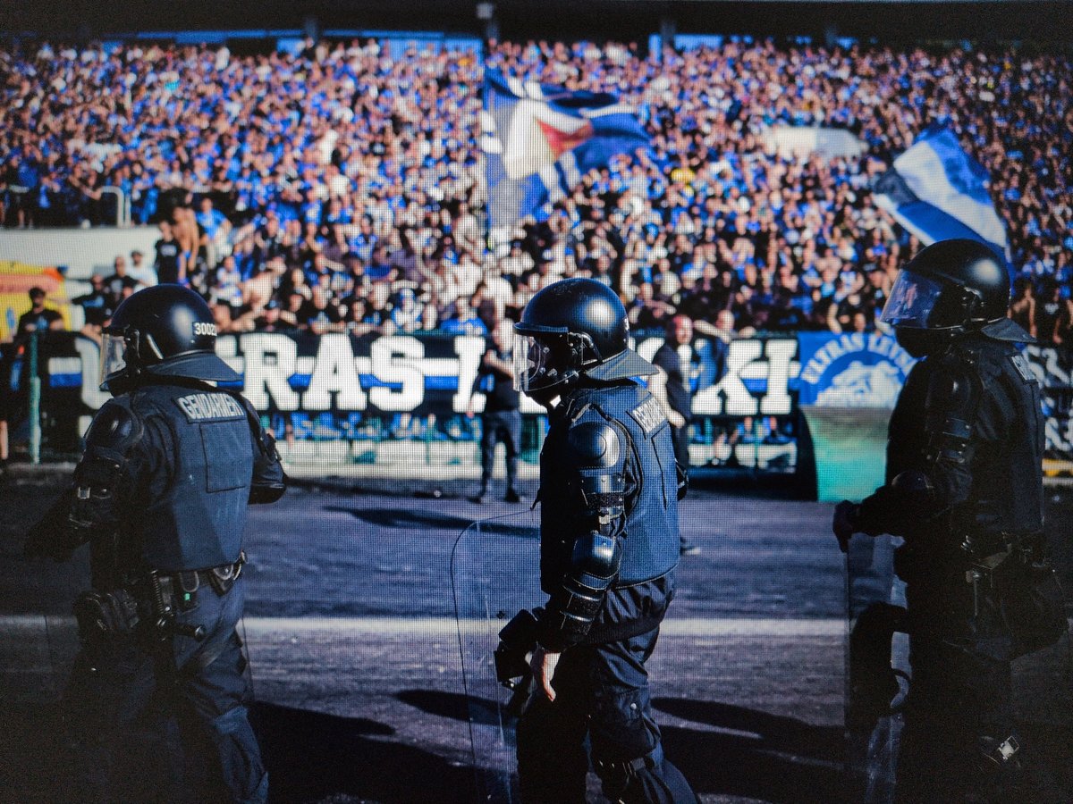 Riot police deploy at stadium during sporting event