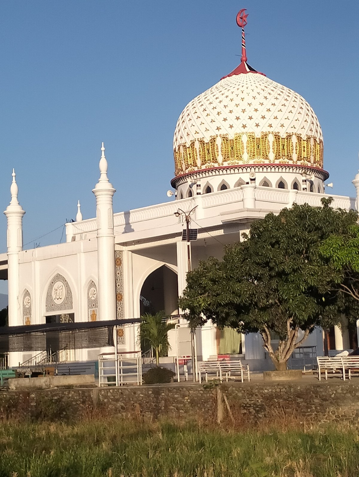 Ornate mosque and street scenes from Blangmetimu, Indonesia