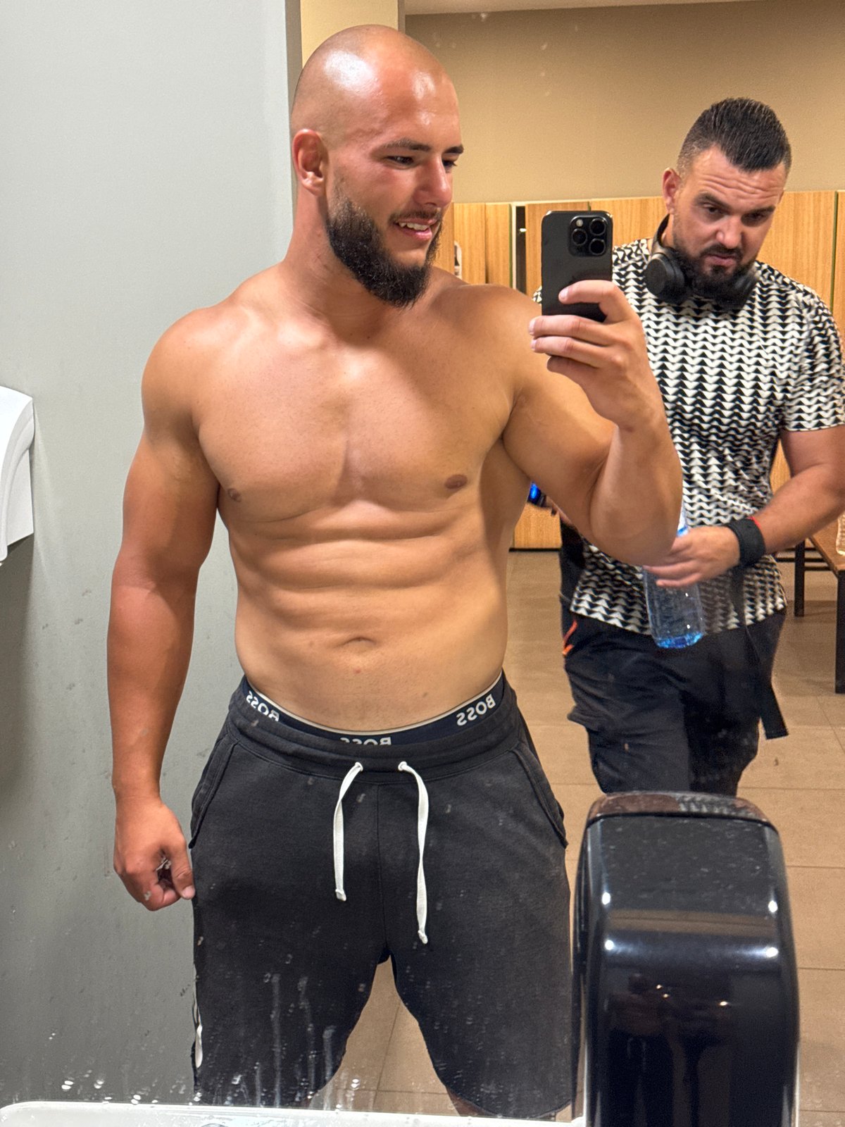 Post-workout mirror selfie session in a Sofia gym locker room