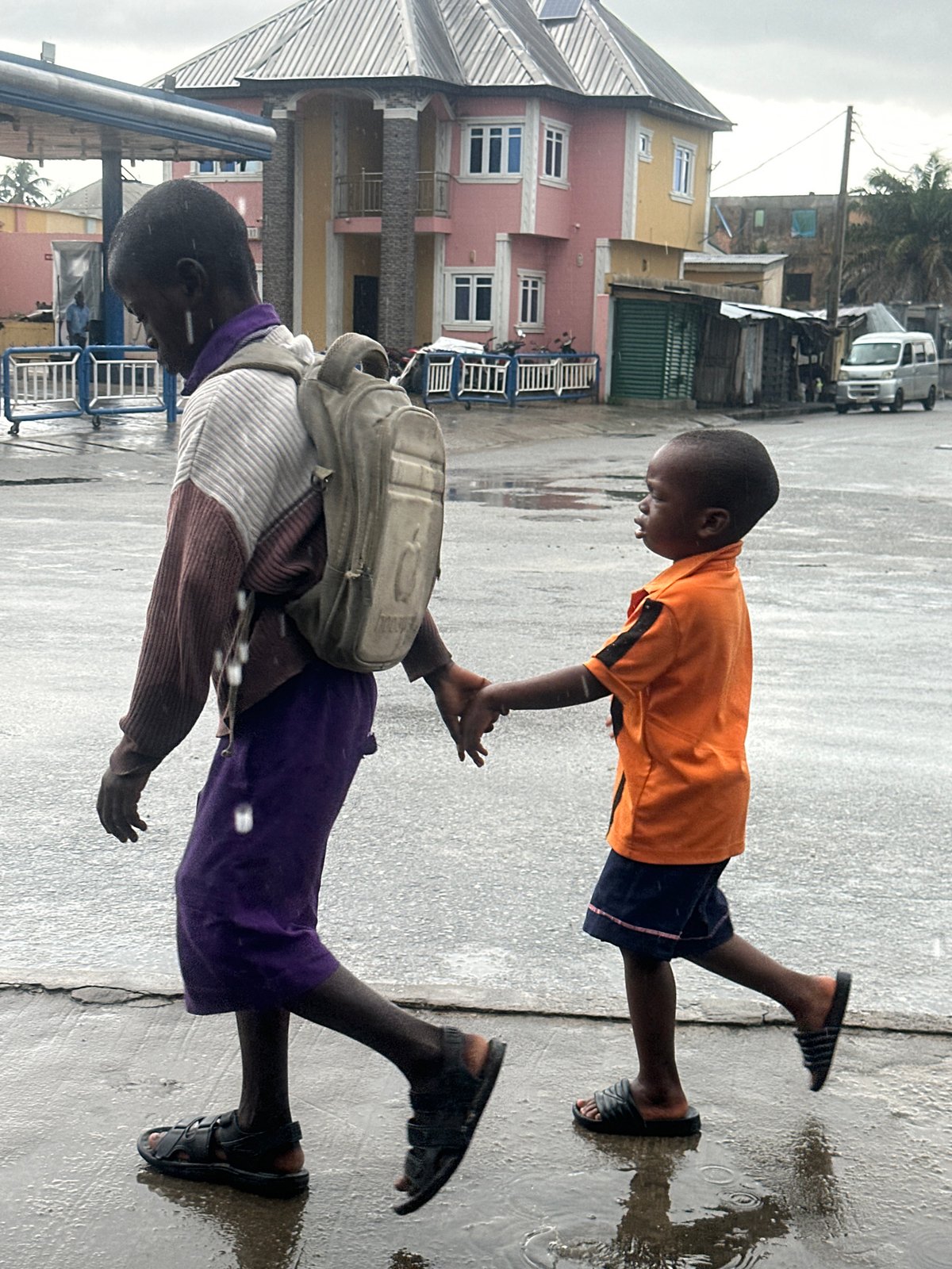 Rainy morning commute on foot and motorbike in Badagry