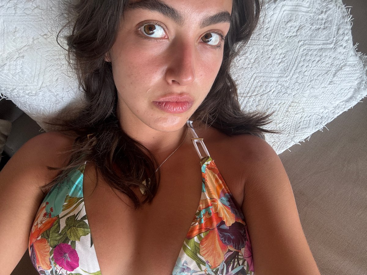 Woman reads book while lounging in Mexico