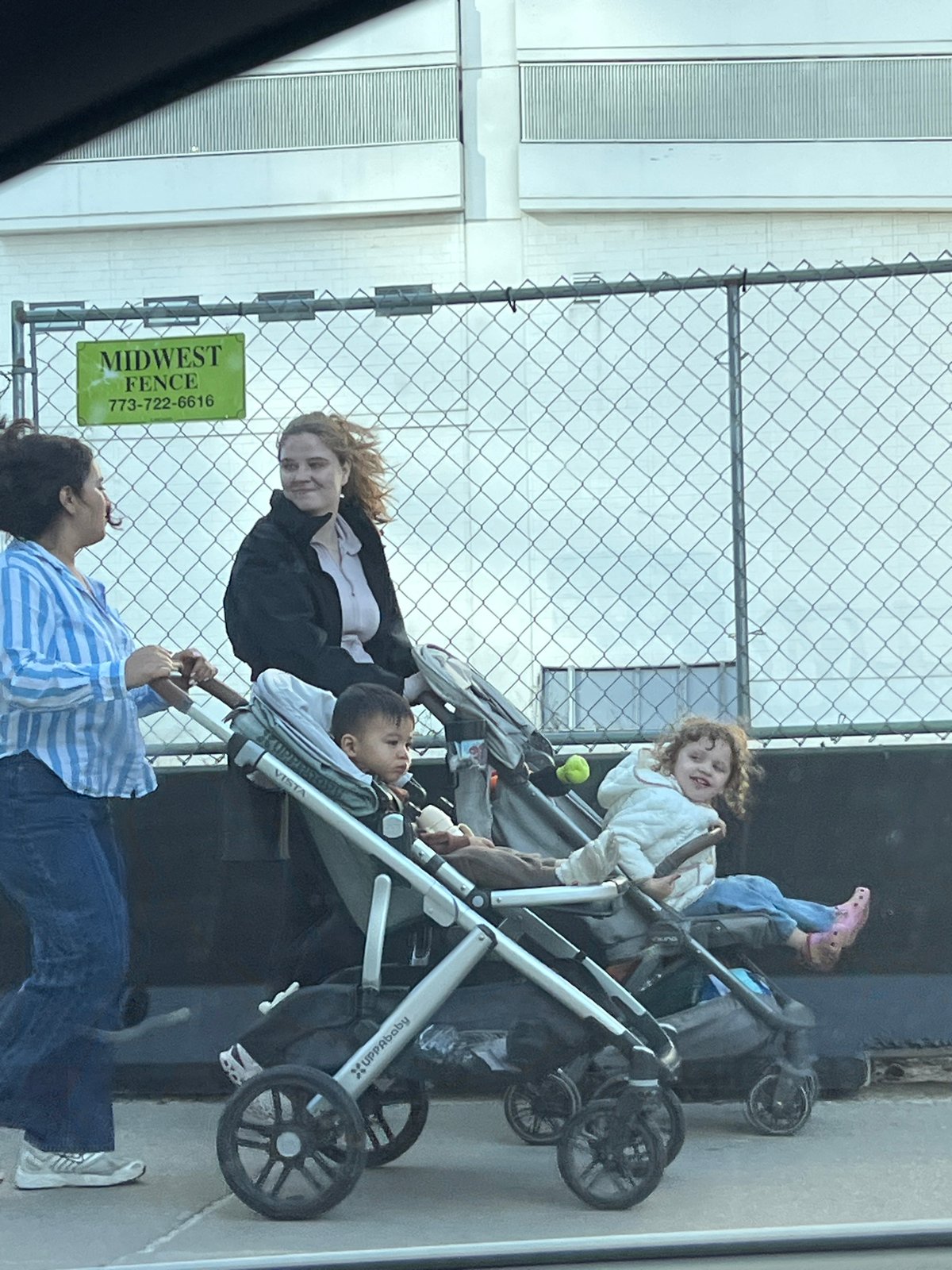 Two adults with strollers spotted interacting in Chicago