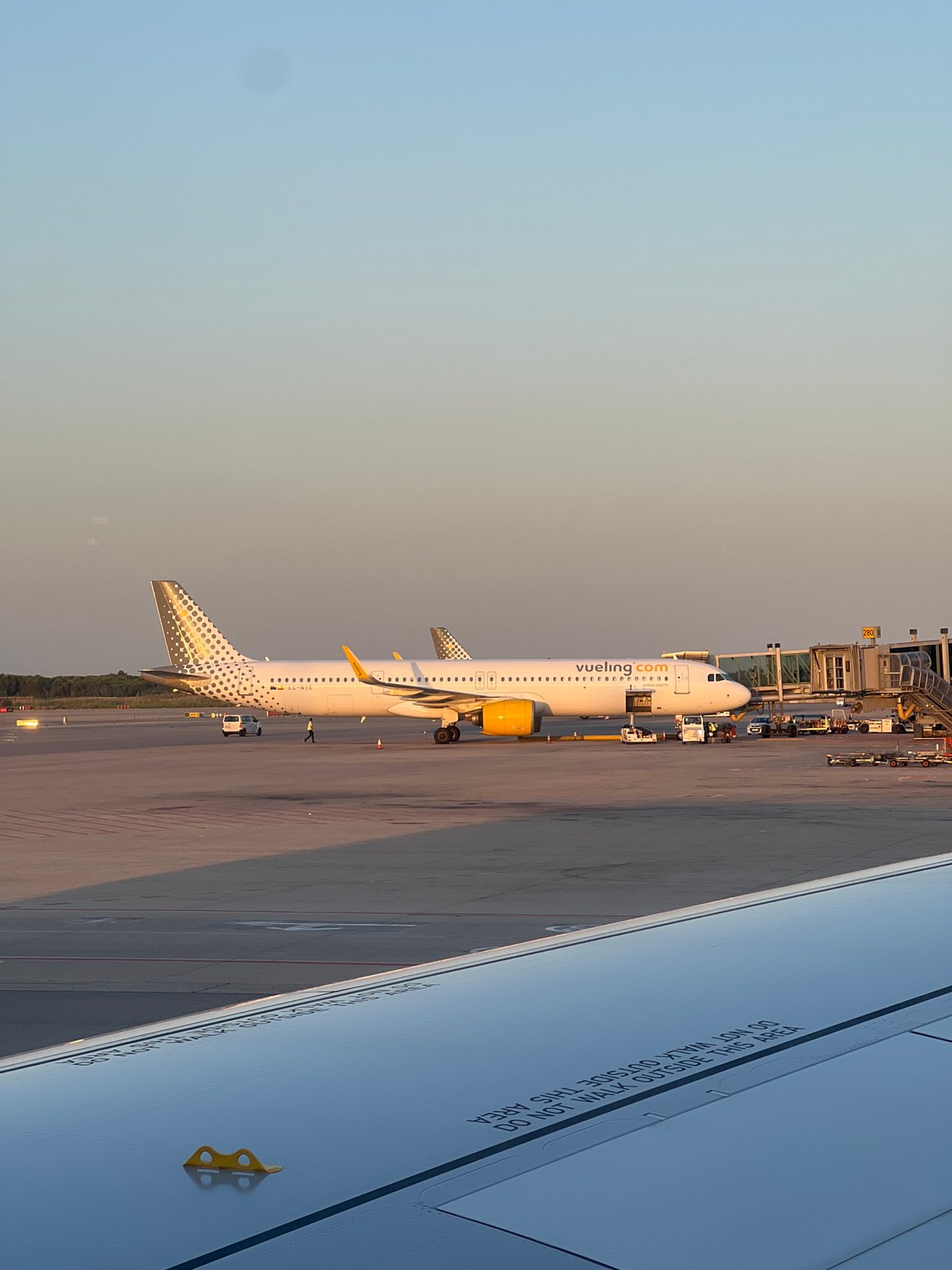 Evening scenes from Barcelona–El Prat Airport, planes at the gate