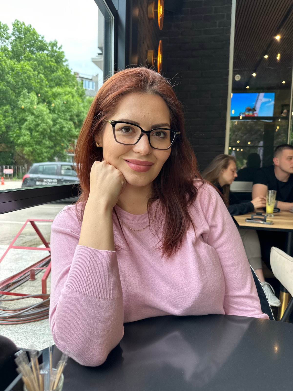 Woman enjoys café moment in Montana, Bulgaria