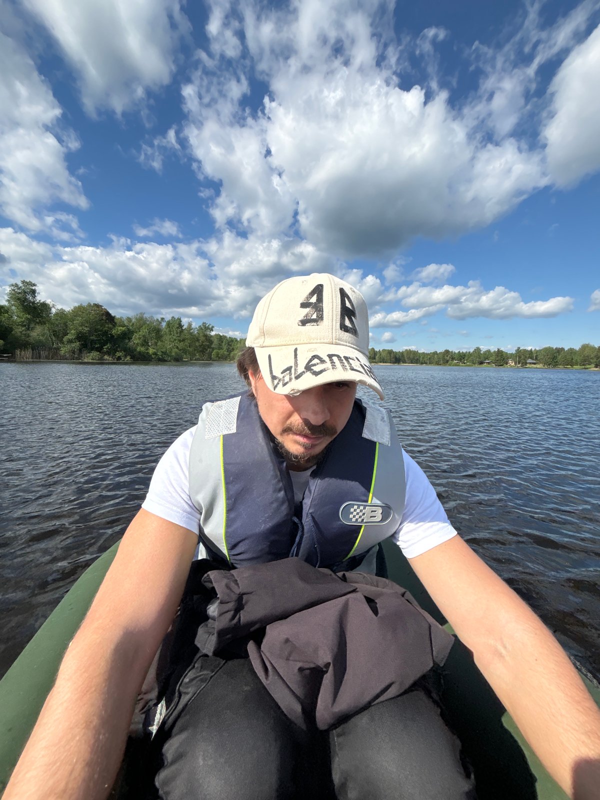 Family lake outing with boating and gazebo gathering documented