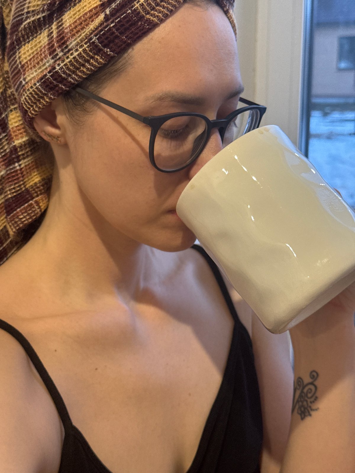 Woman enjoys morning coffee in Chaikovsky, Russia