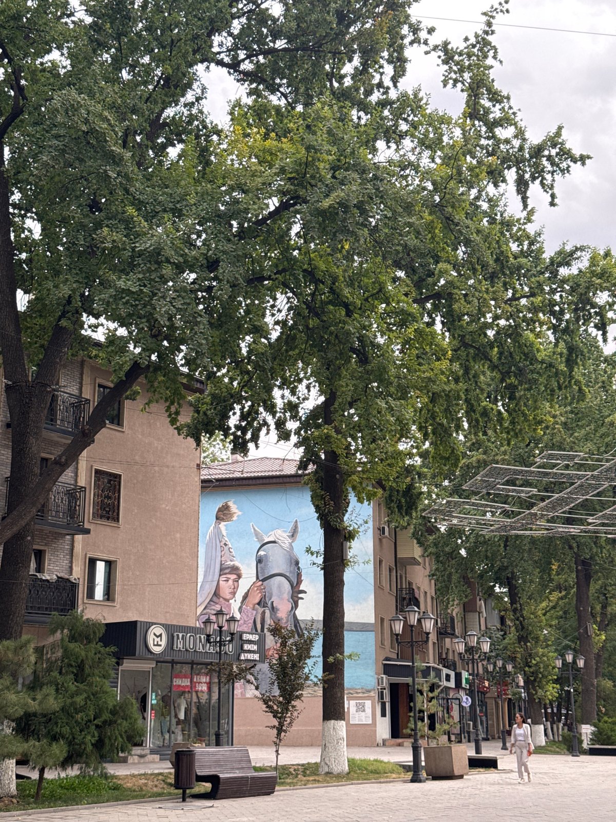 Shymkent's decorated pedestrian promenade on a July morning