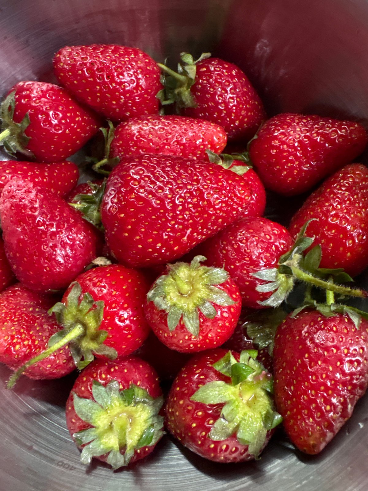 Memorial flowers and fresh strawberries observed in Chaika, Ukraine