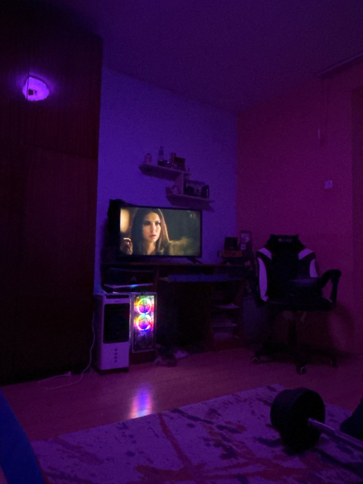 Quiet evening in a Kamenar home with gaming gear and a sleeping cat