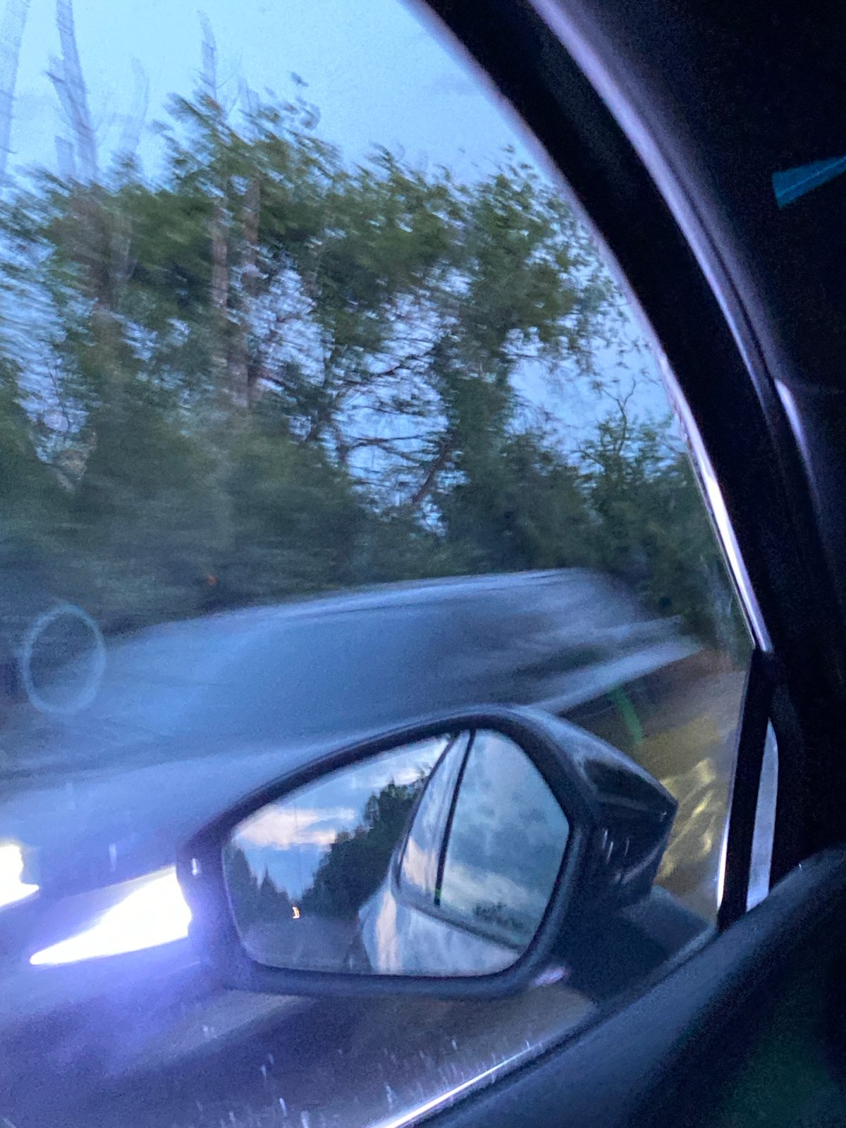 Evening car journey through urban landscape with traffic lights
