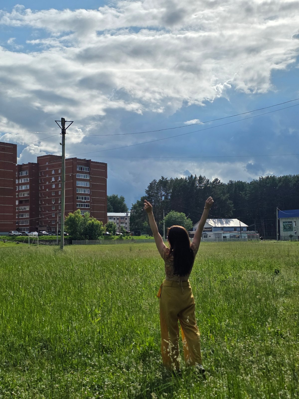 Woman documents park visit and fishing scene in Chaikovsky