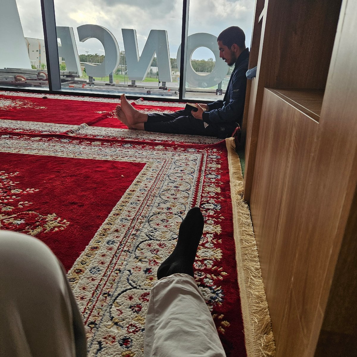 Evening indoor moments captured in Rabat residence with prayer rugs