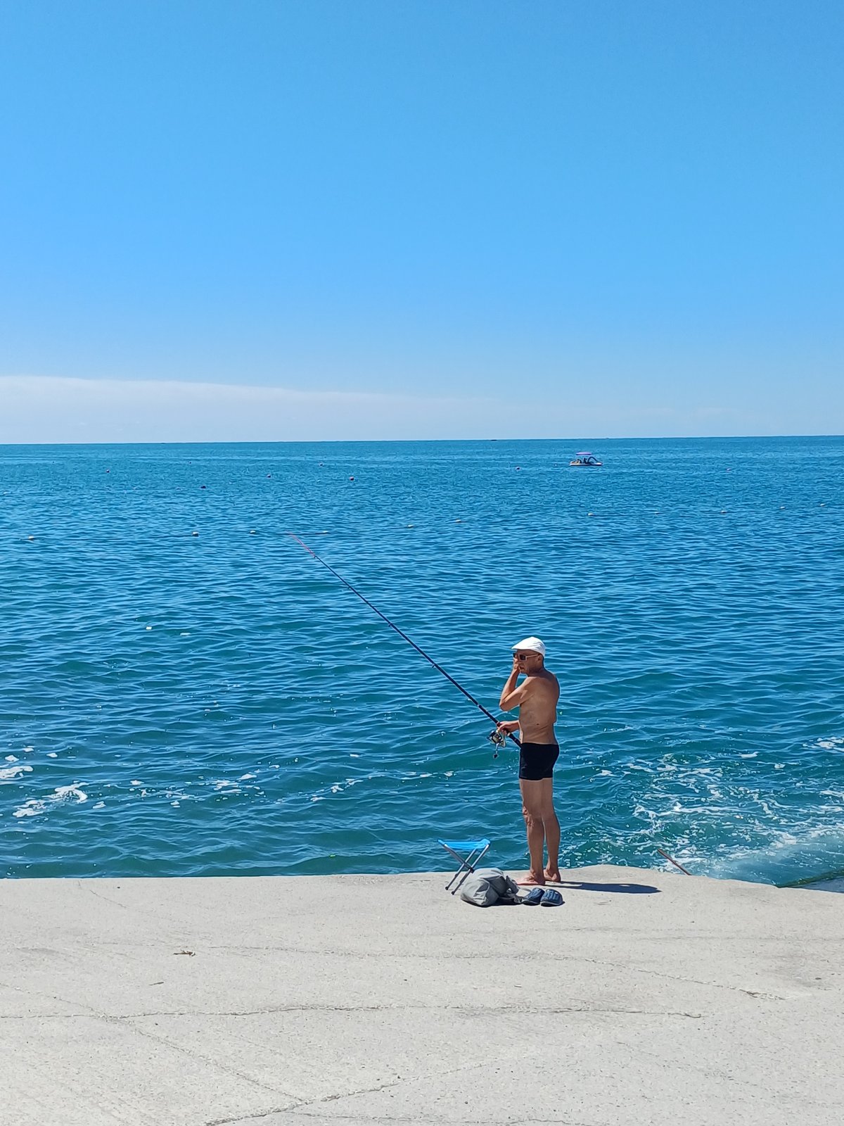 Sochi's Black Sea beach packed on a sunny summer morning