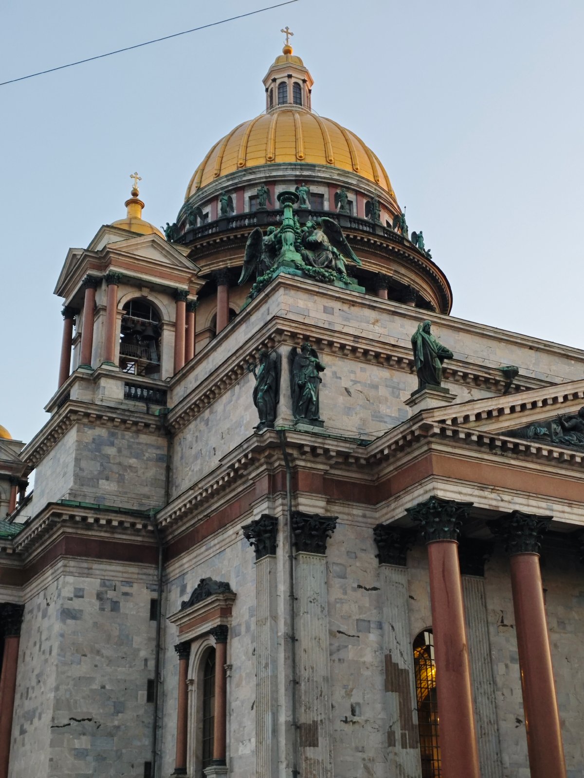 Evening tourist activity captured around Saint Isaac's Cathedral, Saint Petersburg