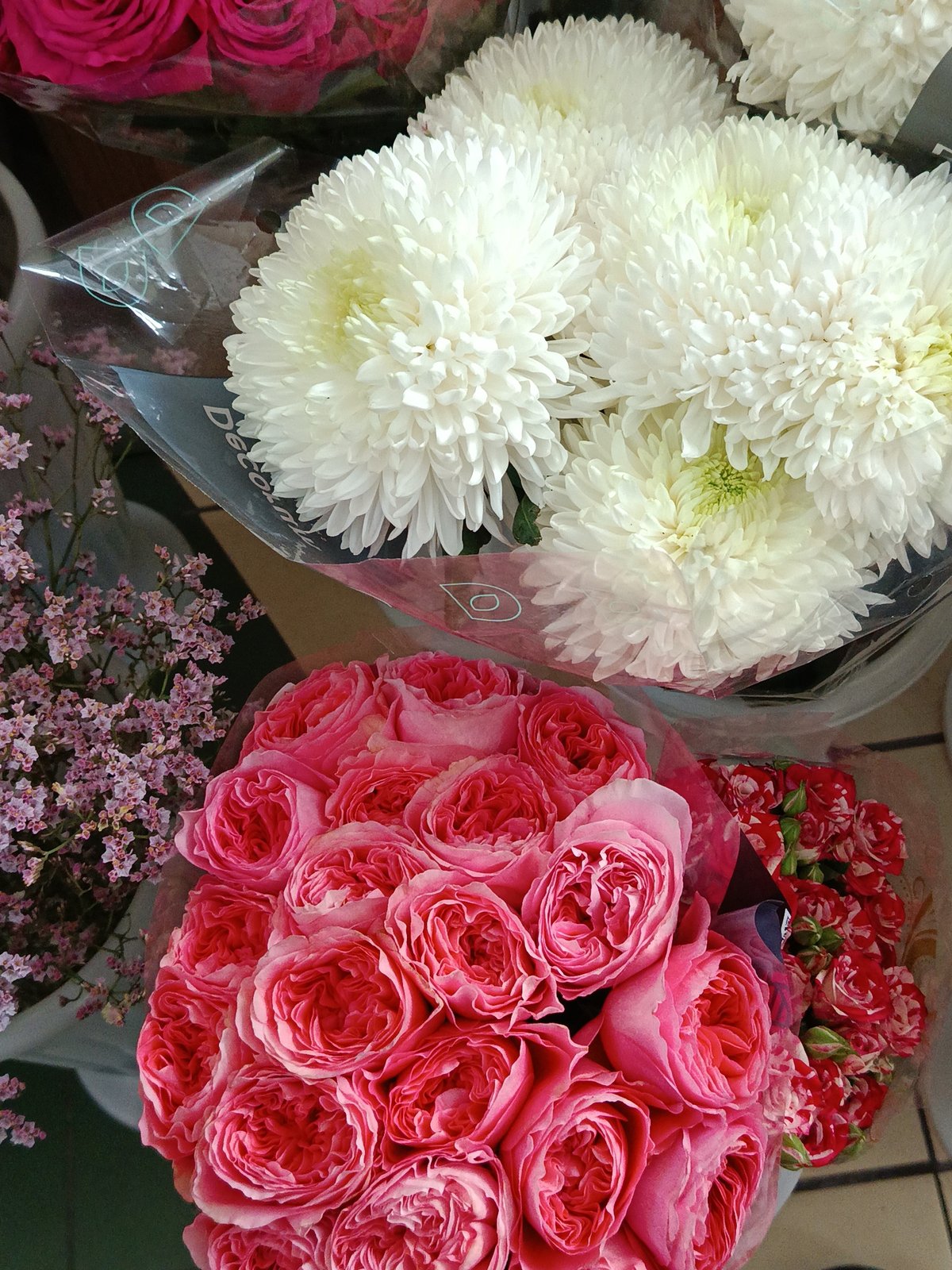Moscow retail shops display flowers, gifts, cosmetics in morning hours