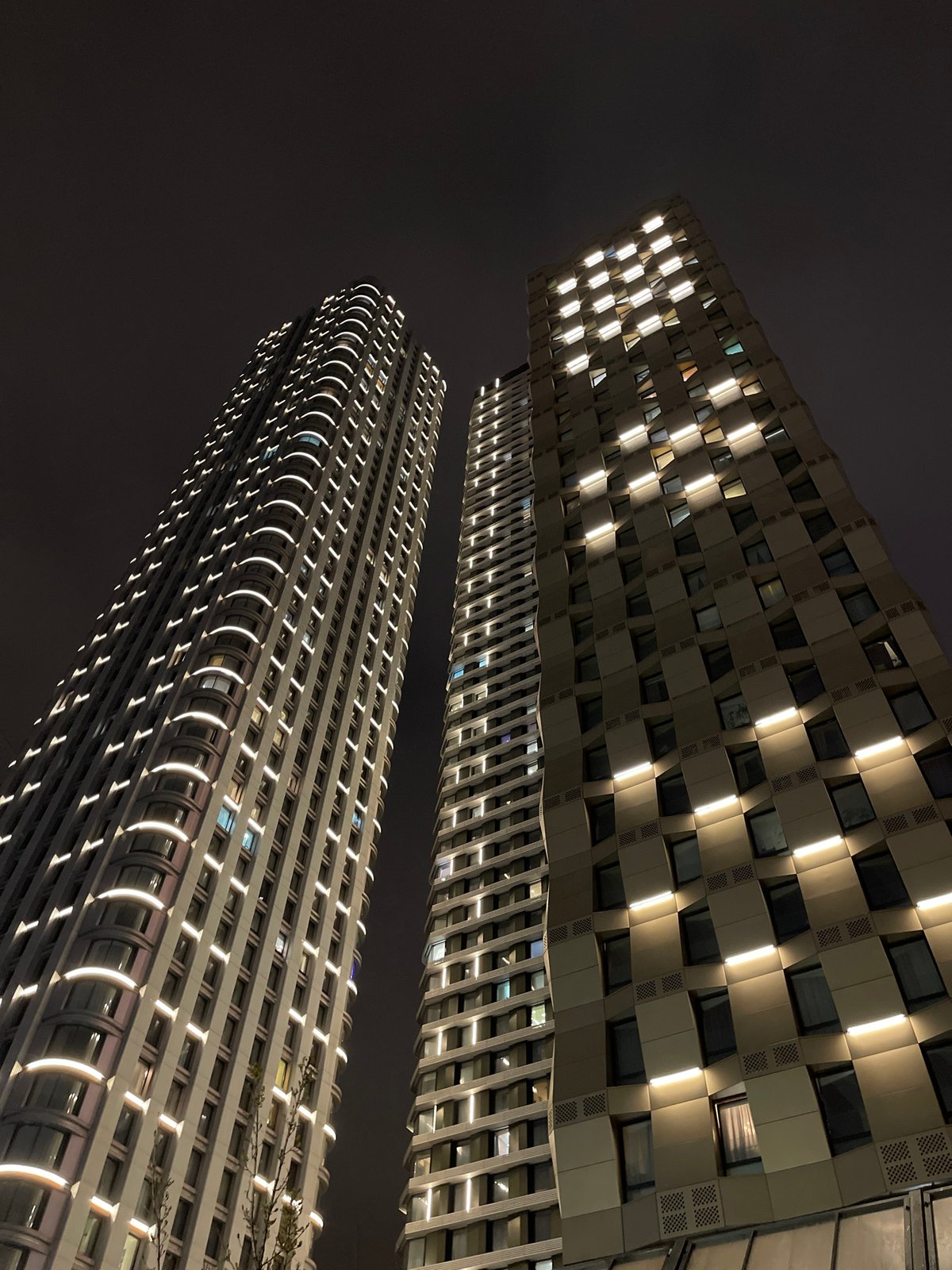 Evening scenes of illuminated buildings and flower bouquets in Khimki