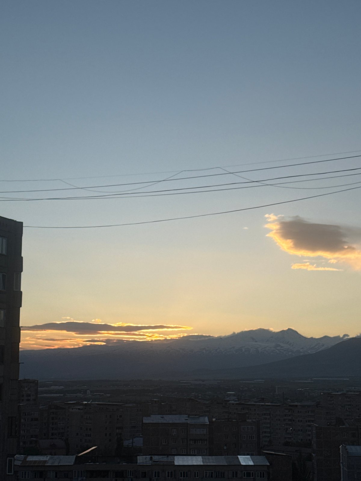 Sunset clouds illuminate Abovyan Armenia cityscape May 29