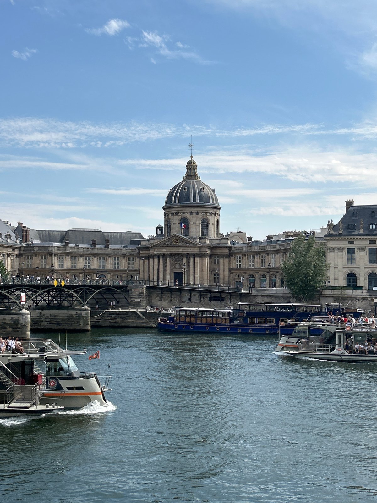 Tour boats on the Seine, Paris landmarks in the background
