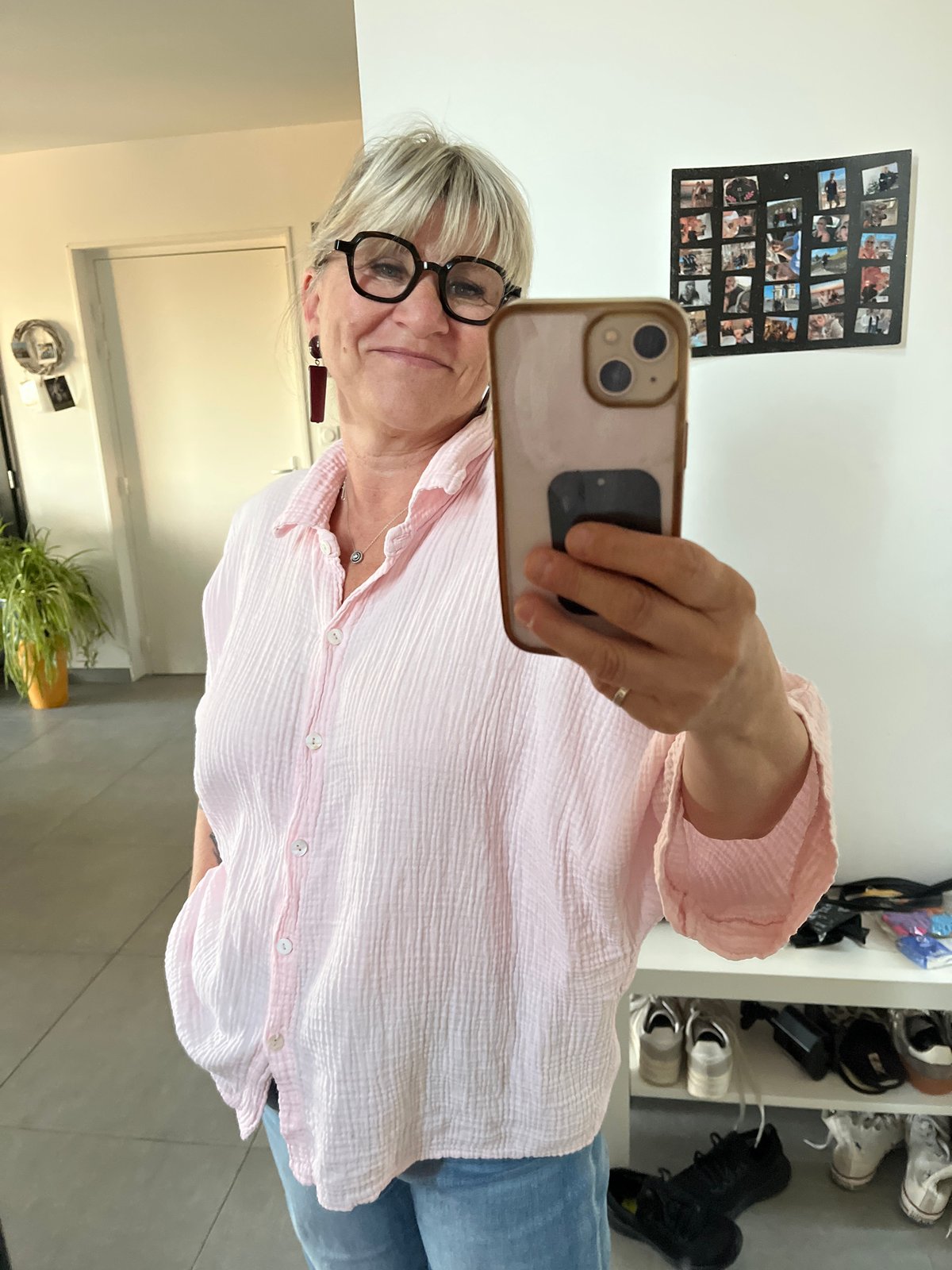 Woman takes mirror selfie in Chambœuf, France early morning