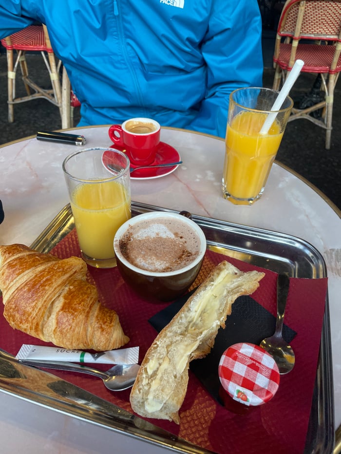 Morning café scene captured at Paris outdoor restaurant