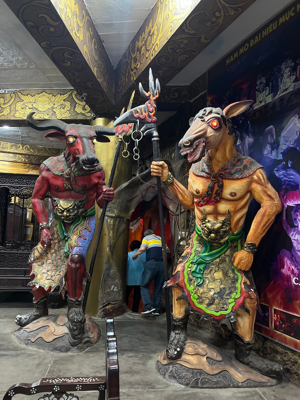 Visitor documents ornate Linh Phuoc Pagoda architecture in Vietnam