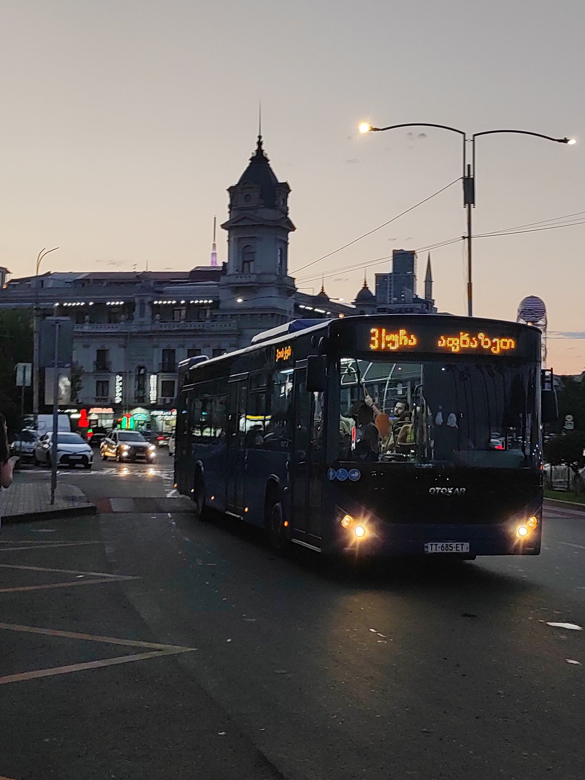 Batumi at dusk: buses, cable cars, and harbor views