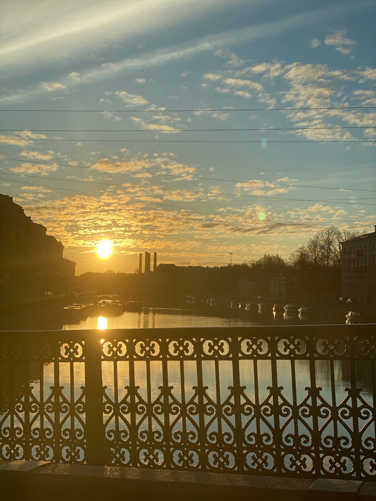 Golden hour sunrise illuminates Saint Petersburg canals and architecture