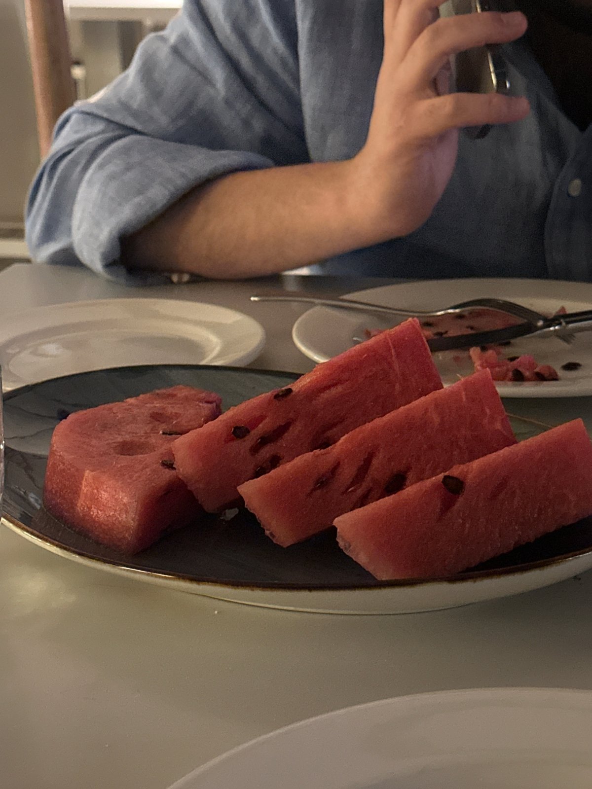 Evening moments captured in Yerevan: watermelon serving and cinema facade