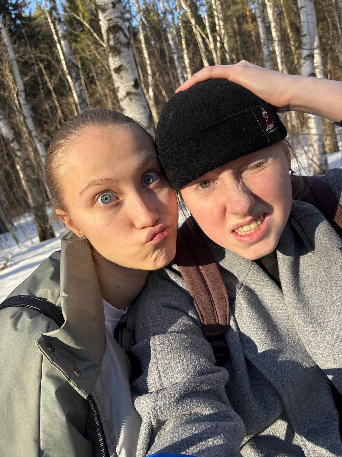 Friends take selfies on sunny Perm street