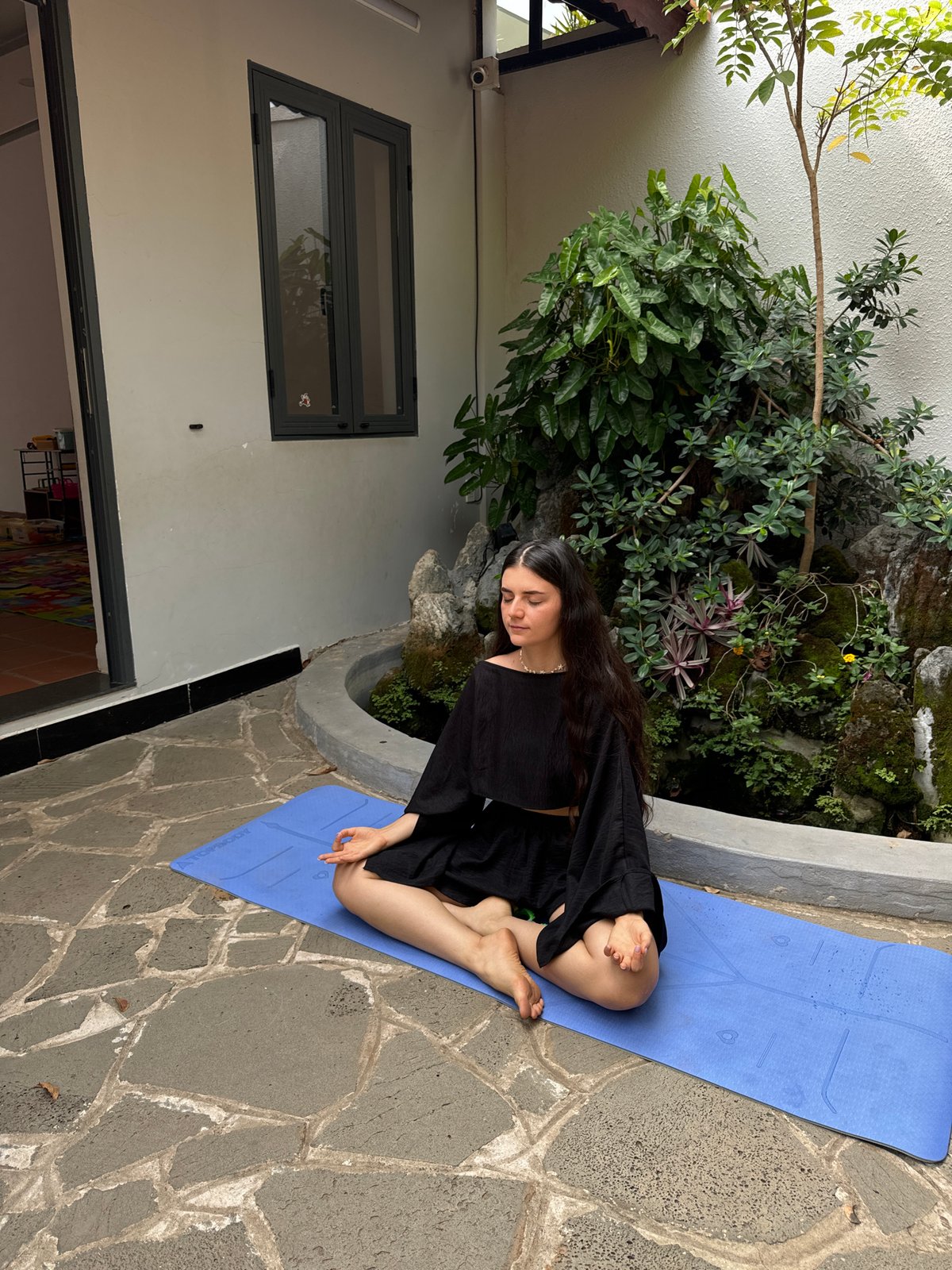 Woman practices yoga, poses for photos in Mũi Né