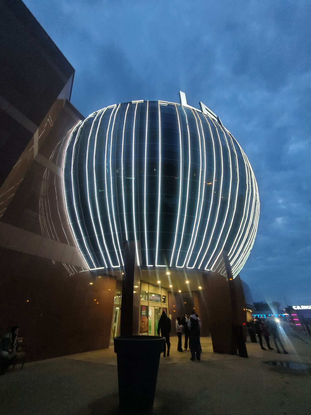 Evening illumination highlights Kosmoport cinema complex in Samara