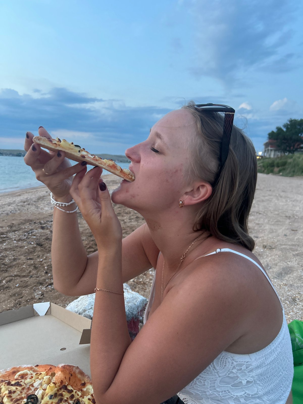Pizza on the beach in Shchelkino on a cloudy June day