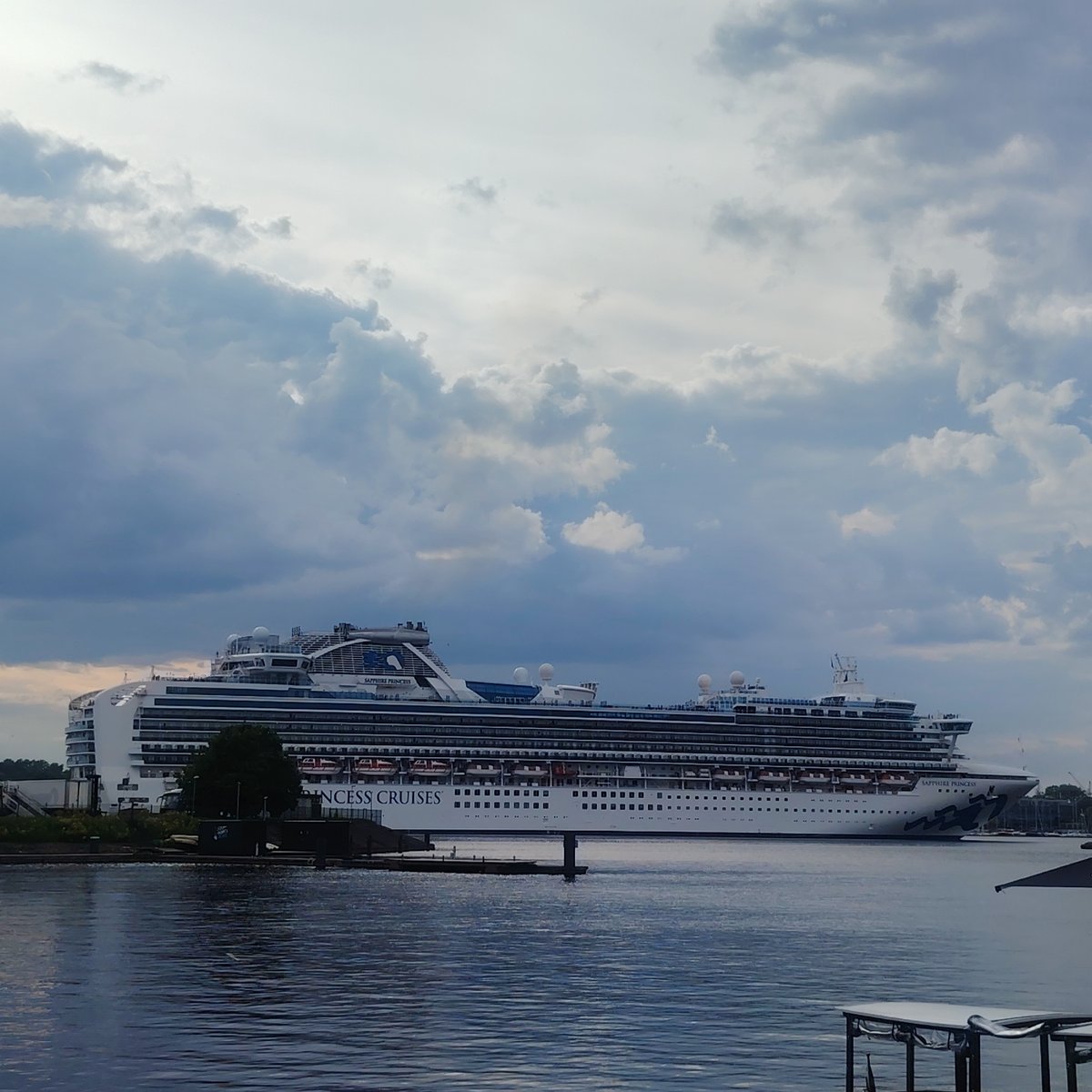 Cruise ships dock at Riga waterfront during busy afternoon