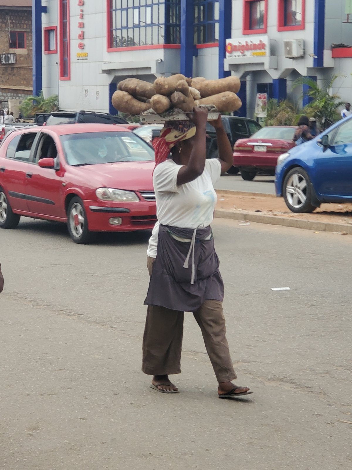 Street vendors conduct business at Jos market