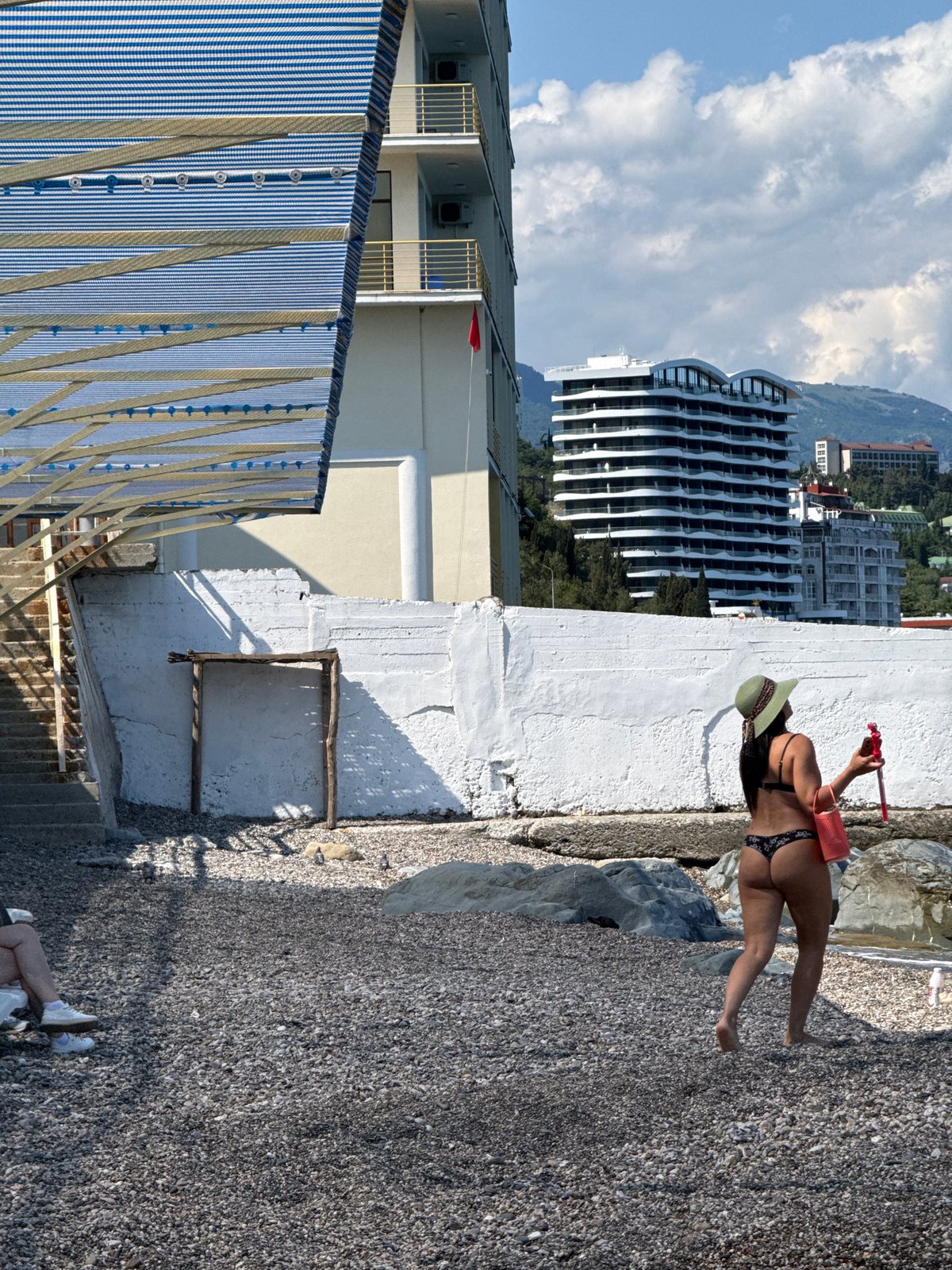 Sunny beach day captured by visitors at coastal resort