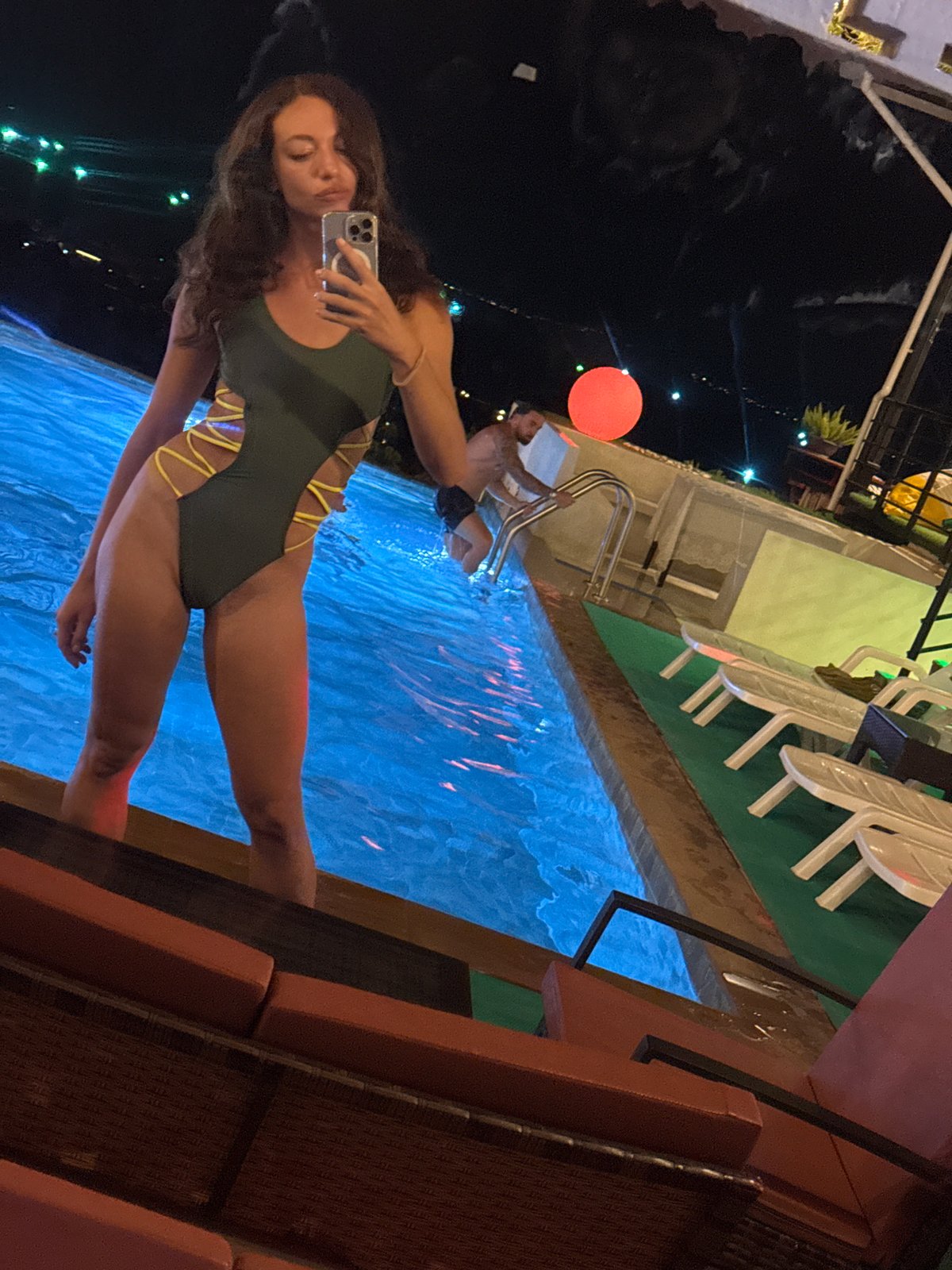 Woman takes poolside selfies in บ้านบางรักษ์, Thailand