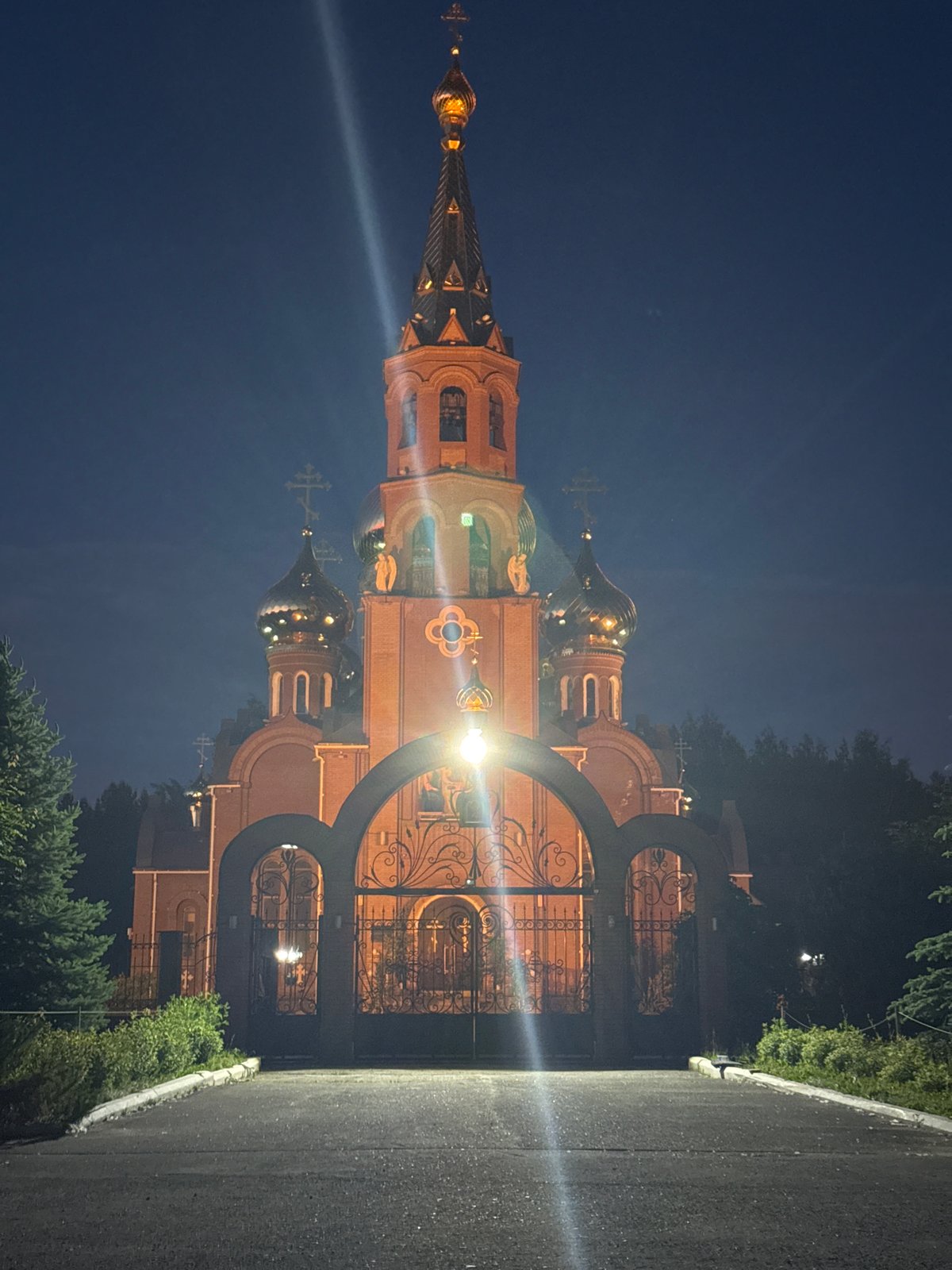 Evening snapshots document church, selfies, playground in Chaikovsky, Russia