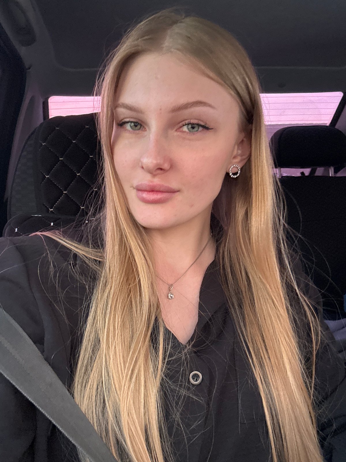 Woman takes selfies in car in Кондратово, Russia