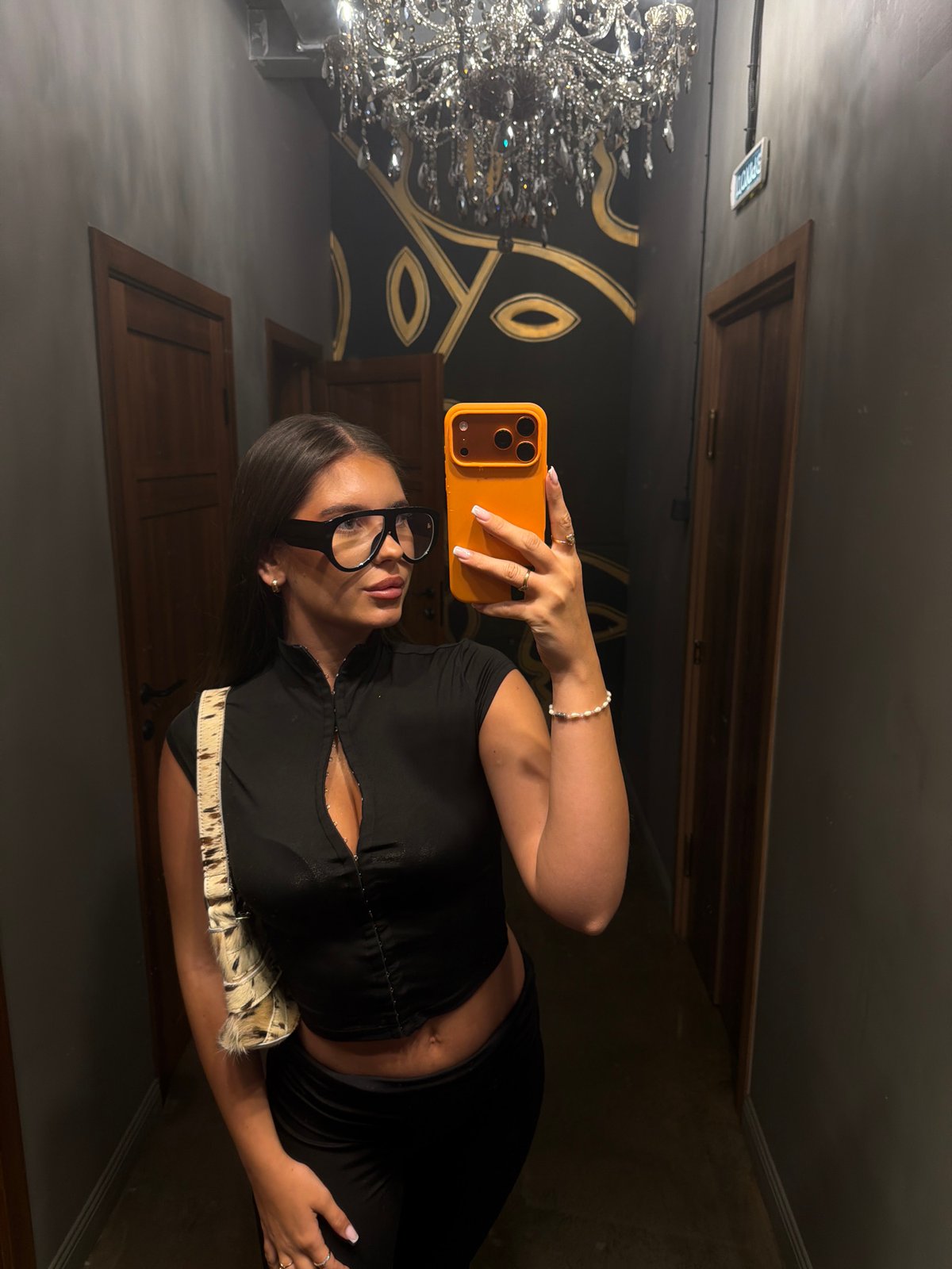 Woman takes selfie in stylish Krasnoyarsk interior setting