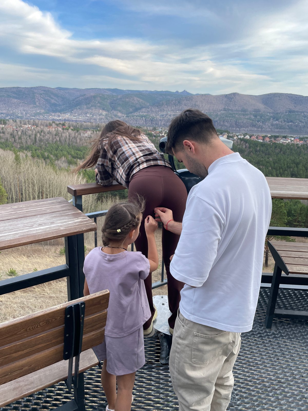 Family enjoys panoramic view from elevated Krasnoyarsk vantage point