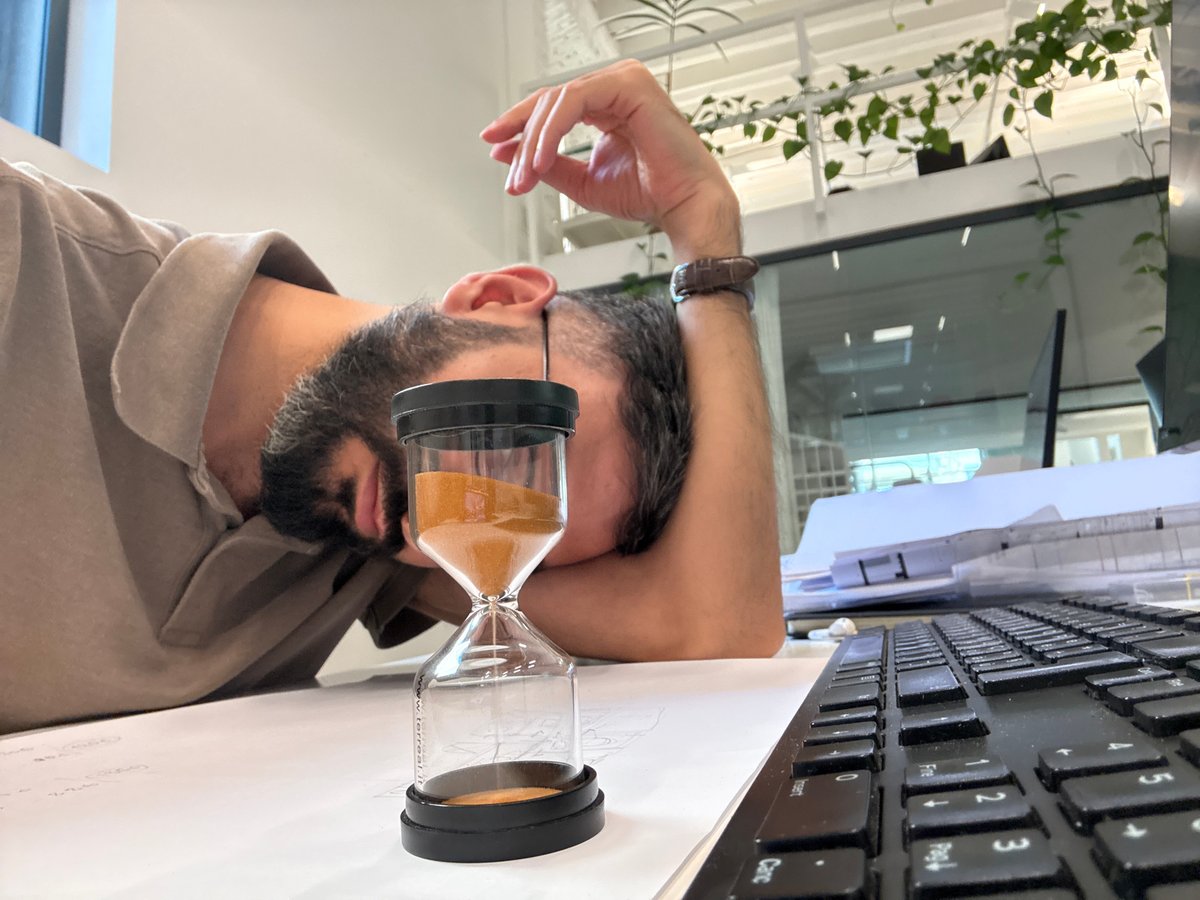 Midday burnout at a Milan office desk