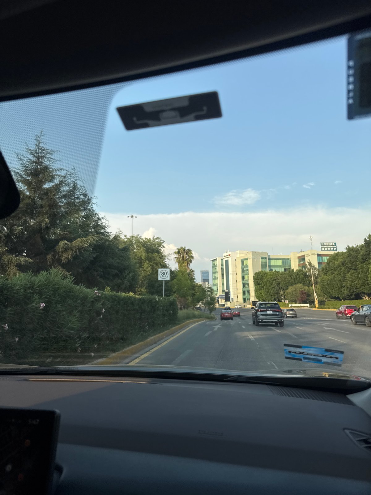 Evening traffic observed on multi-lane street in Puebla, Mexico