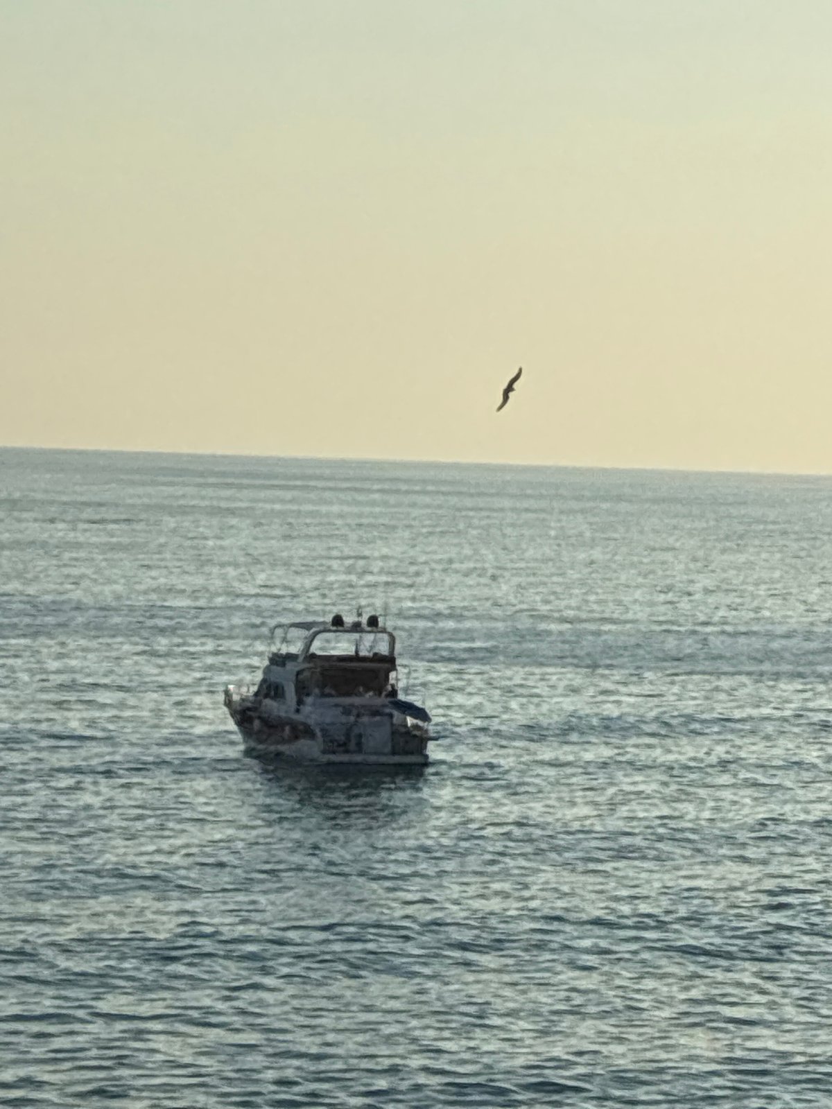 Alanya coastline: boats, beaches, and a burning vessel