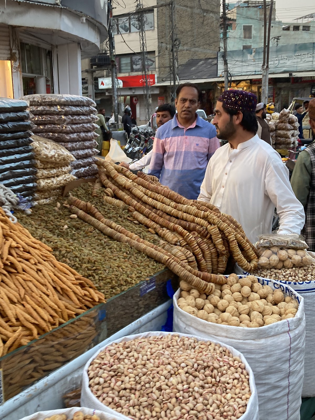 Men gather for street market and indoor meetings