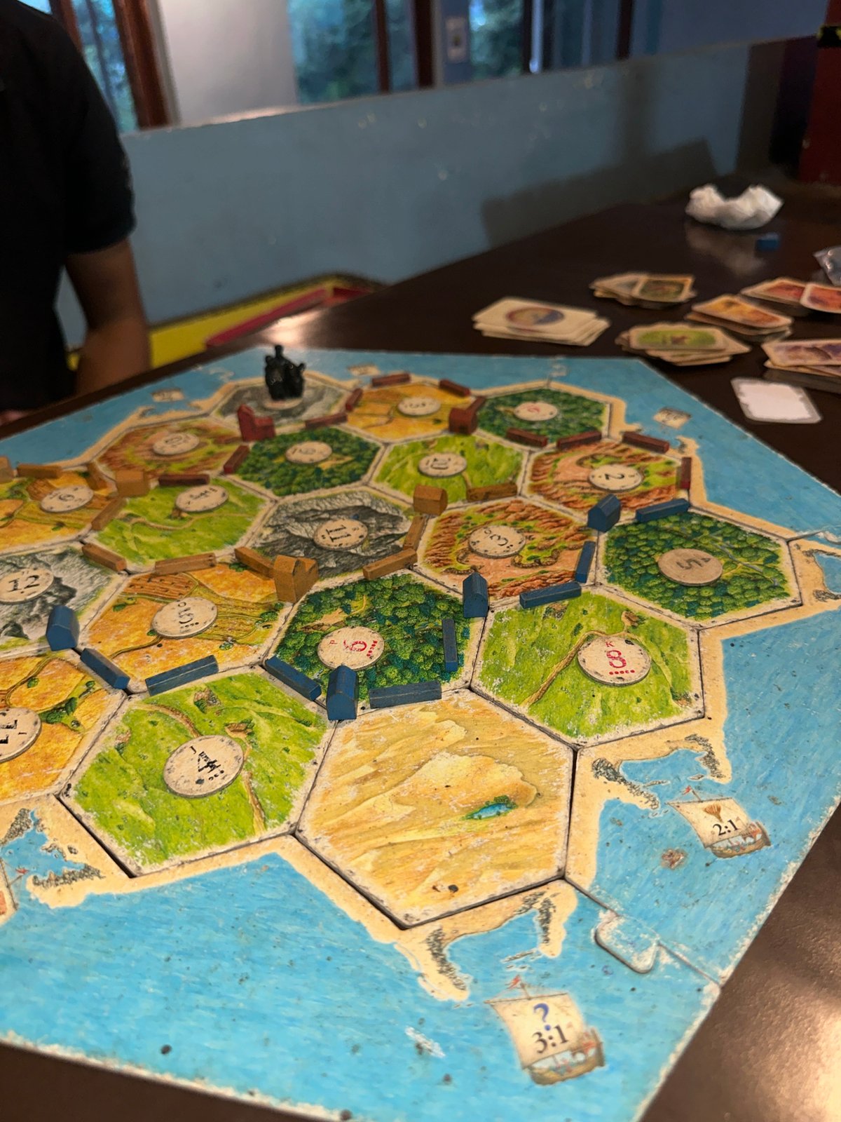 Board game session and outdoor exploration on a hilly afternoon