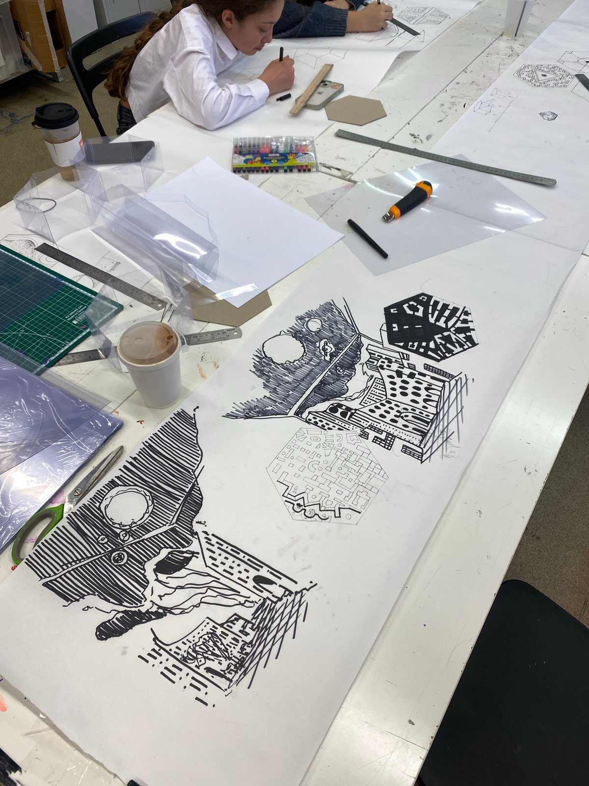 Young artist draws at organized workspace in Moscow