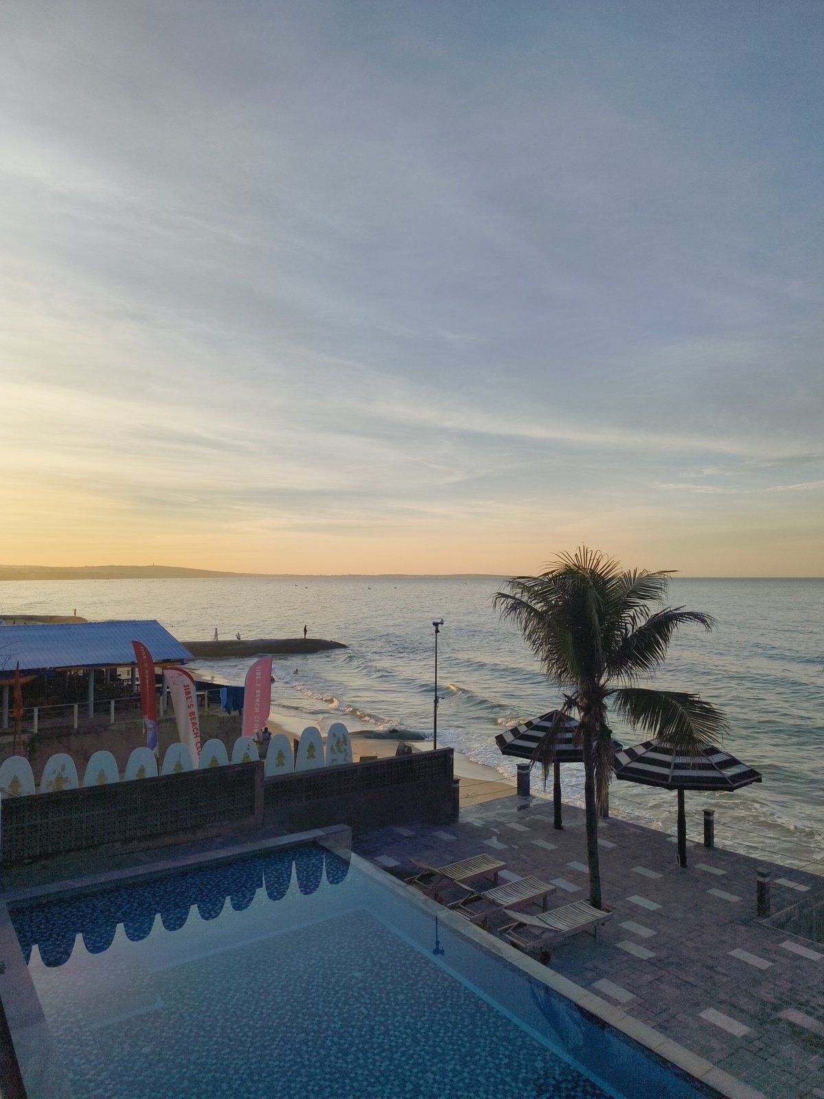 Relaxed evening at a tropical beach resort pool